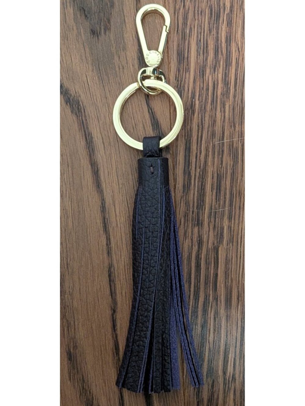 NWOT Coccinelle Leather Tassel Bag Charm in shade Prune